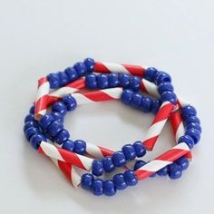 three bracelets with red, white and blue beads on each one stranded together