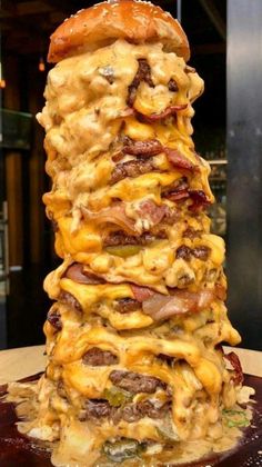 a stack of food sitting on top of a wooden table