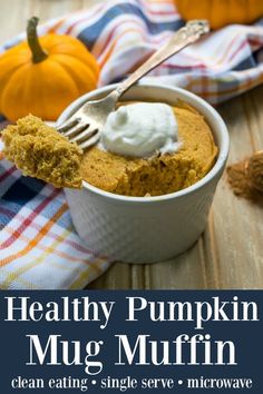 a spoon with some food in it on top of a table next to pumpkins