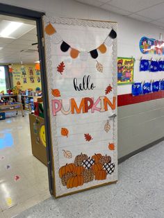 a bulletin board with the words hello pumpkin written on it in front of a classroom