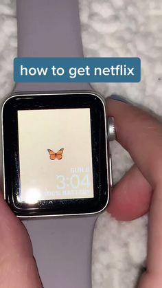 a person holding a smart watch with the text, how to get netflix on it