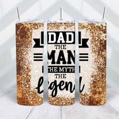 two personalized tumblers with the words dad and the man on them are shown