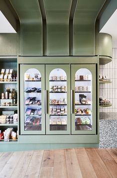 a large display case in the middle of a kitchen