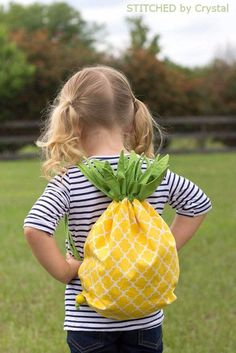 Launch a profitable craft business with these easy-to-sew drawstring backpacks!  Our free pineapple pattern lets you create cute and practical gifts from fabric scraps.  Perfect for beginners, this cute kids' project offers endless possibilities for customization. Start making money today with DIYjoy's sewing crafts.  
.#DIYCrafts #CuteCrafts Pineapple Bag, Diy Sy, Sac Diy, Diy Backpack, Trendy Sewing, Costura Diy, Sell Diy, Beginner Sewing Projects Easy, Crafts To Make And Sell