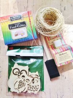 some crafting supplies are laying out on the table next to it's packaging