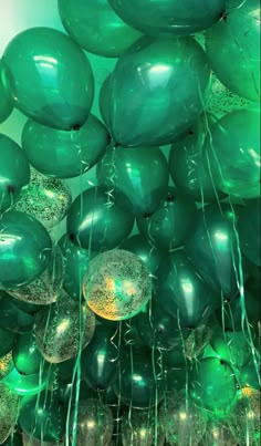 green balloons are floating in the air