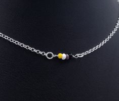 "Handmade sterling silver necklace. Dainty acrylic beads making up the nonbinary pride flag. Delicate silver chain. Order at least 2.5 cm (1\") longer than the intended wearers neck for a tight fit. Longer for a looser fit. Matching bracelet: https://www.etsy.com/listing/1023652477 Necklace and bracelet set (lower price): https://www.etsy.com/listing/1009678292 This is is a made to order listing and you'll get a necklace like the one in the pictures, not the exact copy in the pictures. Please co Silver Beads Choker Jewelry Gift, Silver Beaded Chain Choker As A Gift, Gift Sterling Silver Necklace With Spacer Beads, Sterling Silver Necklace With Spacer Beads As Gift, Silver Spacer Beads Choker For Gift, Silver Pendant Jewelry With Spacer Beads, Silver Chain Beaded Necklaces With Round Beads As Gift, Gift Beaded Necklaces With Silver Chain And Round Beads, Silver Round Beads Choker For Gift