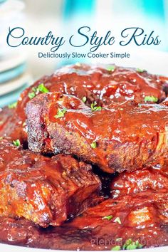 a plate with ribs covered in bbq sauce and garnished with parsley