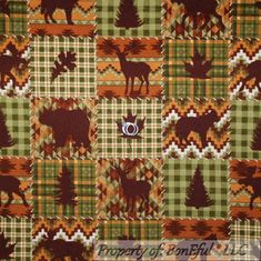 a green and brown checkered fabric with moose, trees, and mountains on it