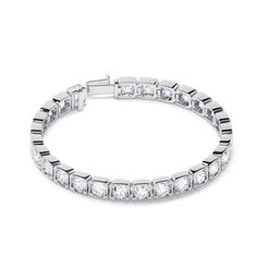 A grwn twist on a classic essential. Our Square Bezel Round Brilliant Tennis Bracelet features Round Brilliant Lab Diamonds set in a Squared Bezel. This piece adds depth and dimension your wrist stack and also has quite the presence when worn alone. This bracelet is available in 3ct - 8ct. ﻿Total carat weight listed is based on 7 inch length (6.5 inch will weigh slightly less) Luxury Tennis Bracelet With Bezel Setting, Luxury Cubic Zirconia Bracelet With Bezel Setting, Elegant Bezel Set Bangle Bracelet, Luxury Bracelets With Bezel Setting And Round Cut, Elegant Bangle Bracelet With Bezel Setting, Luxury Bracelets With Bezel Setting For Anniversary, Luxury Bracelets With Bezel Setting, Elegant White Gold Tennis Bracelet With Bezel Setting, Formal Fine Jewelry Bracelets With Bezel Setting