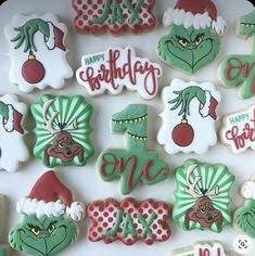 decorated cookies are arranged in the shape of grin's face and numbers for one day