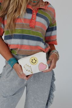 So cute! Take your boho style to the next level with the adorable Smile In Style Pouch—the perfect accessory for any occasion! Convenient pouch style bag with eye-catching details Faux leather material with so CUTE Smiley face, lightning bolt and heart patch designs Convenient zipper pouch closure *Due to lighting and differences in monitors, actual colors may vary slightly from what appears online. Model is 5'8" and wearing a size One Size. Approximate measurements are as follows: ONE SIZE: Len Trendy White Pouch Clutch, Trendy White Pouch For Daily Use, Trendy White Zipper Pouch, Trendy White Cosmetic Bag, Trendy White Clutch Pouch, Trendy White Clutch With Zipper Pouch, Trendy White Everyday Pouch, Trendy White Clutch For Everyday Use, Trendy Cream Clutch For Everyday Use