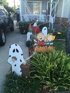 halloween decorations on the front lawn of a house