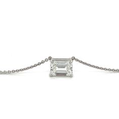 "3-carat emerald cut solitaire pendant set in 18-karat white gold connecting cable chain necklace. The chain seamlessly attaches to the bail on the east and west side of the pendant with perfect symmetry and grace. Enjoy 7-day risk free returns for a full refund if you're not 100% satisfied. Diamond: - Carat: 3.03 - Color: G - Clarity: VS2 - Cut: Emerald - Type: Lab-Grown Diamond CVD Setting: - Metal: 18K White Gold - Pendant Size: 10.2mm x 7mm - Setting: 4-Prong Solitaire - 4.48 grams Necklace: Formal Platinum Necklace With Emerald Cut, White Gold Emerald-cut Diamond Necklace, Emerald Cut Platinum Necklace For Anniversary, Fine Jewelry Emerald Cut Solitaire Necklace For Anniversary, Fine Jewelry Emerald Cut Emerald Necklace In White Gold, Emerald Cut Solitaire Necklace For Anniversary, Fine Jewelry White Gold Emerald Cut Emerald Necklace, White Gold Emerald-cut Necklace With Diamond Cut, White Gold Emerald Cut Emerald Necklace