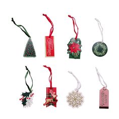 six christmas ornaments are arranged in the shape of an ornament, with ribbons and tags attached to them