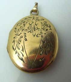 "For sale: (1) s895 Vintage Gold Filled Oval Cabochon Floral Etched Locket Pendant PLEASE READ ENTIRE DESCRIPTION BEFORE PURCHASING Pre-owned item. Good condition. Please see pictures for details. Sold as is, as seen on pictures.We always test all metals, no matter if stamped or not. Perfect for daily wear. Would be a nice anniversary, birthday, Christmas, Mother's Day or Valentine's Day gift for her. This beautiful oval art nouveau features floral engraving in yellow gold filled metal,with plac Cheap Vintage Oval Pendant Necklaces, Luxury Engraved Oval Cabochon Jewelry, Floral Engraving, Locket Necklace Vintage, Strip Pattern, Valentines Day Gifts For Her, Necklace Vintage, Not Perfect, Wristwatch Men