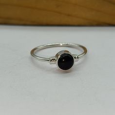 Handmade Black onyx bohemian ring , you can wear this ring as a party wear ring .. Title - Black onyx stone ring Stone color - Black Stone shape - Oval Material - Sterling silver 925 Note - We use natural gemstones, so color shade may be little bit different .. we are giving you best quality rings on best price .. contact us for more quantity Black Sterling Silver Stackable Open Rings, Adjustable Black Sterling Silver Stackable Rings, Black Moonstone Gemstone Ring, Onyx Silver Ring, Ring Black Stone, Quality Rings, Black Stone Ring, Bohemian Ring, Black Onyx Stone