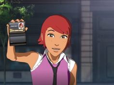 a woman holding up a cell phone in front of her face with an anime character on the screen