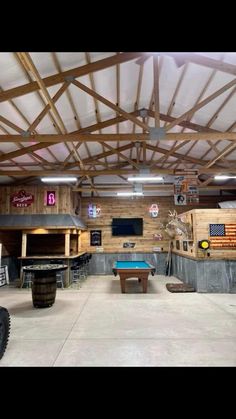 an indoor pool and bar area in a building with wooden beams on the ceiling, along with several tables and stools