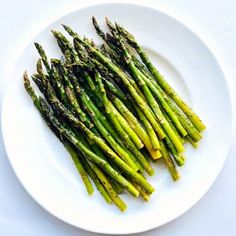 asparagus spears on a white plate