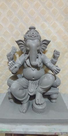 an elephant statue sitting on top of a table