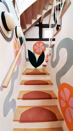 the stairs are painted with flowers and leaves