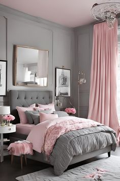 a bedroom with pink and grey decor