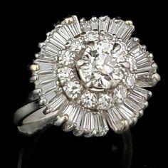 an antique diamond cluster ring with baguets