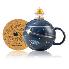 a teapot shaped like an outer space coffee cup