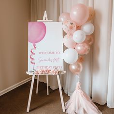 a welcome sign and balloons in front of a birthday party sign on an easel