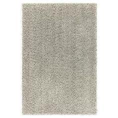 a white rug with grey shag on the top and bottom part of it's surface