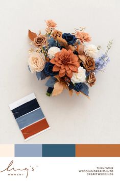 a bouquet of flowers sitting on top of a table next to a color swatch