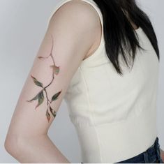 a woman with a tattoo on her arm