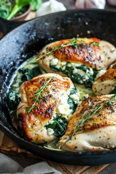 chicken with spinach and cheese in a skillet