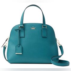 What A Gorgeous Color For Fall And Winter! Not An Easy Color To Find In This Style Now. Beautiful, Rich Teal That Kate Spade Calls Pine Needle. Crosshatched Leather With Gold Tone Hardware. Top Zipper Closure. Hanging Luggage Tag. Two Exterior Slide Pockets. Double Flat Handles With 4.25” Drop. Adjustable And Detachable Cross Body Strap With 22” Drop. Interior Middle Zipper Pocket, One Zipper Pocket And Two Slide Pockets. 11.5"(L) 9"(H) 5”(D). Bottom Protective Metal Feet. (All Measurements Are Teal Handbag, Kate Spade Cameron Street, Pine Needles, Luggage Tag, Kate Spade Bag, Leather Satchel, Fall And Winter, Luggage Tags, Kate Spade New York