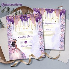 two purple and gold wedding cards on top of each other next to a plate with flowers