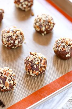 chocolate covered cookies on a baking sheet ready to be baked