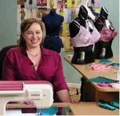 a woman sitting in front of a sewing machine