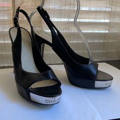 Chanel Black Leather Mules. Size 38-8. 9.75” Long From Tip To Tip Following Slope. 4.75” Heel High. 1” Toe Platform High Or Thickness. Made In Italy. Luxury Black High Heel Mules, Patent Leather Mules With 4-inch Heel, Sleek Patent Leather Mules With 4-inch Heel, Modern Black Mules With 4-inch Heel, Designer Black Mules With 4-inch Heel, Black Leather Mules, Shoes Chanel, Slingbacks, Leather Mules