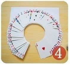 the card game is set up with four different cards and one number on each side