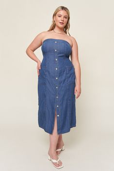 The "Tahoma" dress is everything you love about denim dressing, with all the comfort of breezy linen. This nostalgic piece is inspired by Lo's love for 90s styling and named after her favorite summer hideaway. This strapless style is fitted to be "bra optional" and has a shirred back panel for adjustability and support. Our favorite part about this dress? Besides the pockets, this baby has a gorgeous fixed button placket that ends with a split seam, giving this timeless piece an elevated look th Casual Strapless Denim Dress For Summer, Medium Wash Strapless Summer Dress, Casual Strapless Dark Wash Denim Dress, Casual Dark Wash Strapless Denim Dress, Fitted Casual Strapless Dress, Casual Fitted Strapless Dress, Strapless Denim Blue Dress For Summer, Dark Wash Strapless Dress For Summer, Spring Strapless Sleeveless Denim Dress