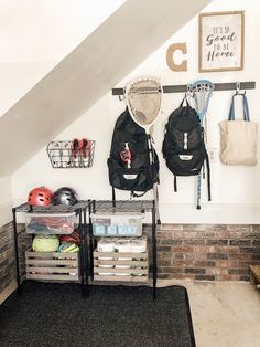 there is a rack with sports gear on it in the room next to some bags