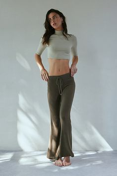 So soft Out From Under knit lounge pant in a cozy relaxed flare silhouette. Designed in a soft & stretchy jersey knit featuring a low-rise, elasticated drawstring waistline and kick-flare hem for an effortless vibe. Only at Urban Outfitters. Features Out From Under Easy Does It Cozy flare lounge pant Low rise lounge pant Soft and stretchy jersey knit Cozy soft feel Low rise waistline with drawstring tie Fitted through waist, hips and thighs Slim flare fit Full length Pull-on construction UO excl Flare Lounge Pants, Knit Cozy, Easy Does It, Flare Pant, Kick Flares, Cozy Knit, Cozy Knits, Lounge Pants, Flare Pants