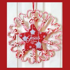 a star shaped ornament with candy canes hanging from it