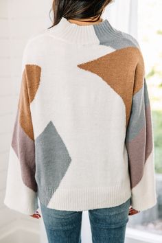 This sweater is so chic and sassy! We love that unique geometric colorblock print! The colors are fab together as well! This mock neck sweater is going to look fab this winter and on into the spring season! This sweater features a mock neckline, long wide sleeves, and a geometric colorblock print. 
Material has a generous amount of stretch.Cindy is wearing the small. Colorblock Sweater, Mint Julep Boutique, Mock Neckline, Color Block Sweater, Model Fits, Mock Neck Sweater, Wide Sleeves, Spring Season, Personal Marketing