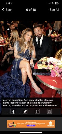 a man and woman sitting next to each other at a table