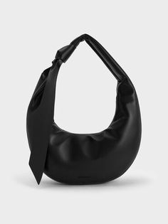 Noir Toni Knotted Curved Hobo Bag | CHARLES & KEITH Coccinelle Bag, Karl Lagerfeld Bag, Charles And Keith Bags, Bag Jacquemus, Backpack Aesthetic, Furla Bag, Charles And Keith, Jacquemus Bag, Ideal Wardrobe