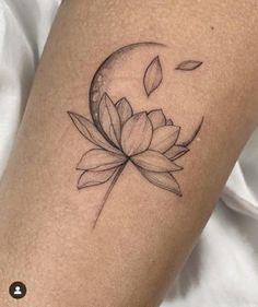 a woman's leg with a lotus flower tattoo on the left side of her thigh