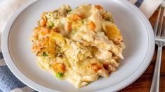 a close up of a plate of food with broccoli and chicken casserole