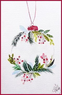 a watercolor christmas ornament with holly and berries